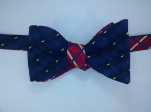 Standard width. gold spots on blue with gold and blue stripes on red.